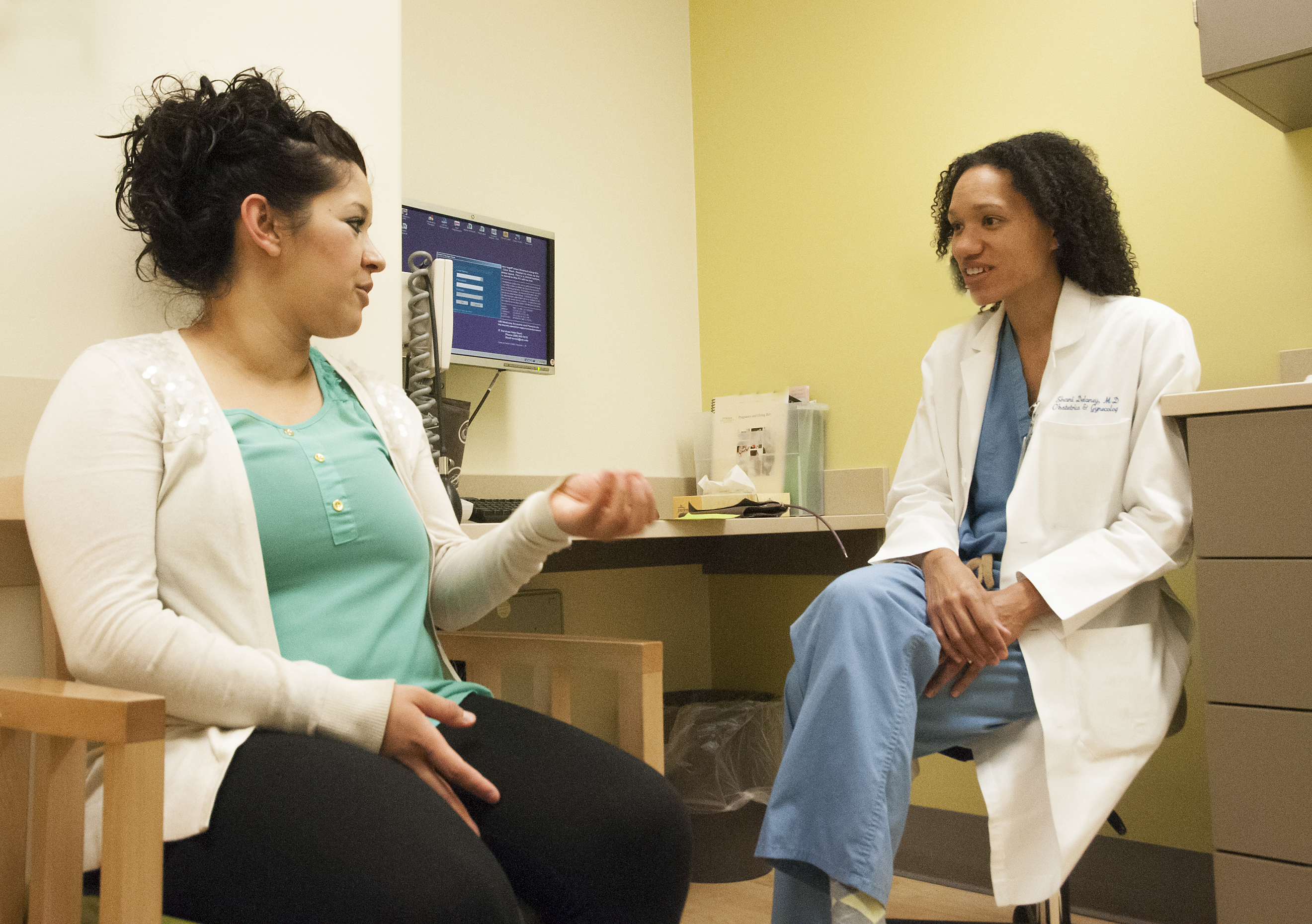 Resident with patient in clinic