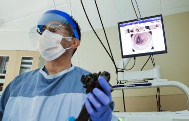 GI Physician holding Colonoscopy tool