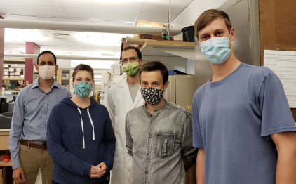 Pictured at far right, with lab members (Left to right): Ajai Dandekar, MD PhD, Nicole Smalley, Kyle Asfahl PhD, Maxim Kostylev PhD