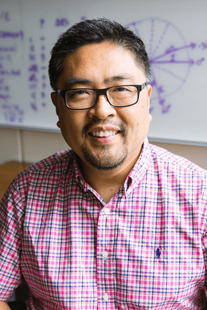 Dr. John Choe smiling.