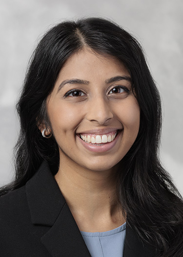 Dr. Sandhu smiling